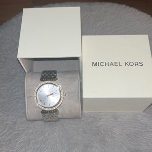 Michael Kors Watch. New with tags, and plastic protective covering. Never worn